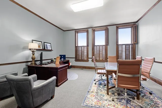 a view of a workspace with furniture