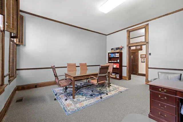 a view of a livingroom with furniture window and wooden floor