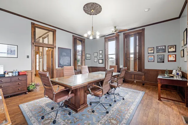 a view of a livingroom with furniture and a chandelier