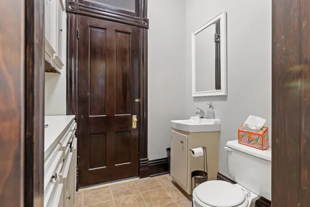 a kitchen with stainless steel appliances granite countertop a sink dishwasher and cabinets with wooden floor