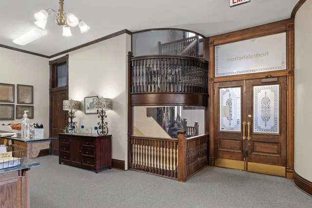 a kitchen with stainless steel appliances kitchen island granite countertop a refrigerator and a stove top oven