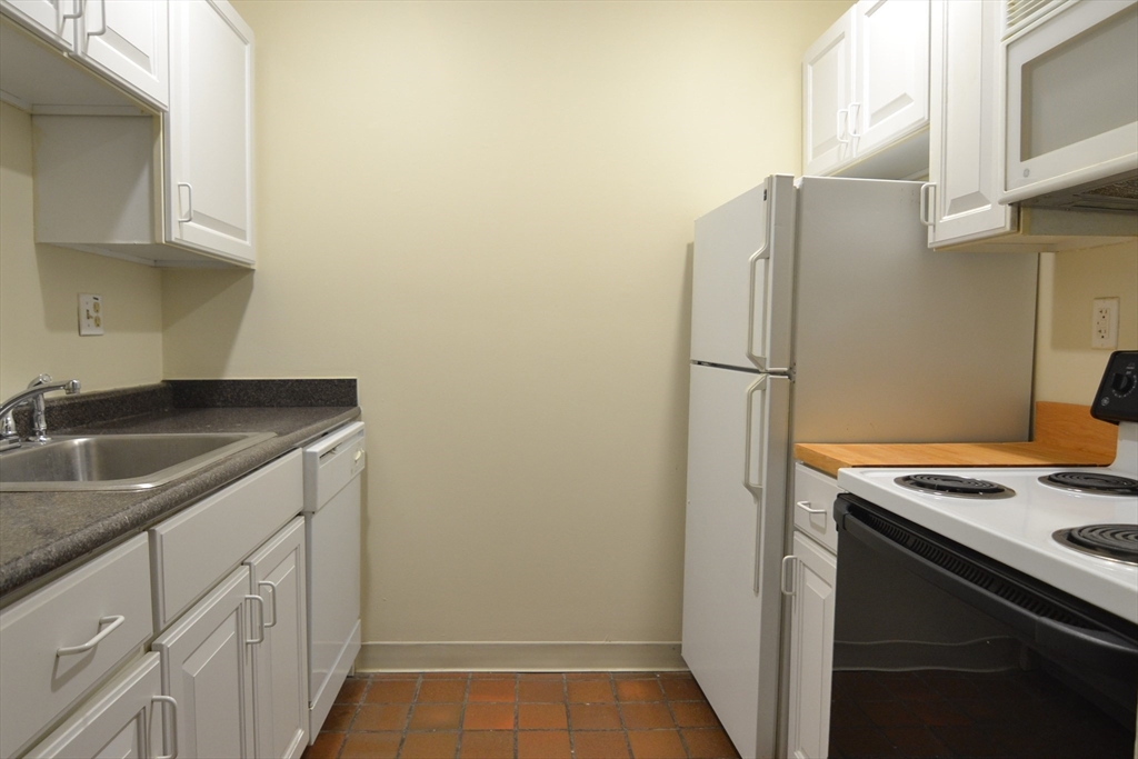 67 St Germain Street, Unit 191 Boston, MA 02115 - Photo 4 of 13 a kitchen with a refrigerator sink and stove