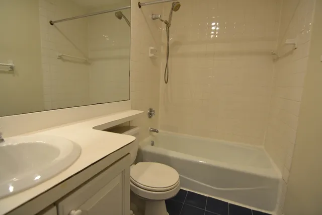 a bathroom with a sink a toilet and a bathtub
