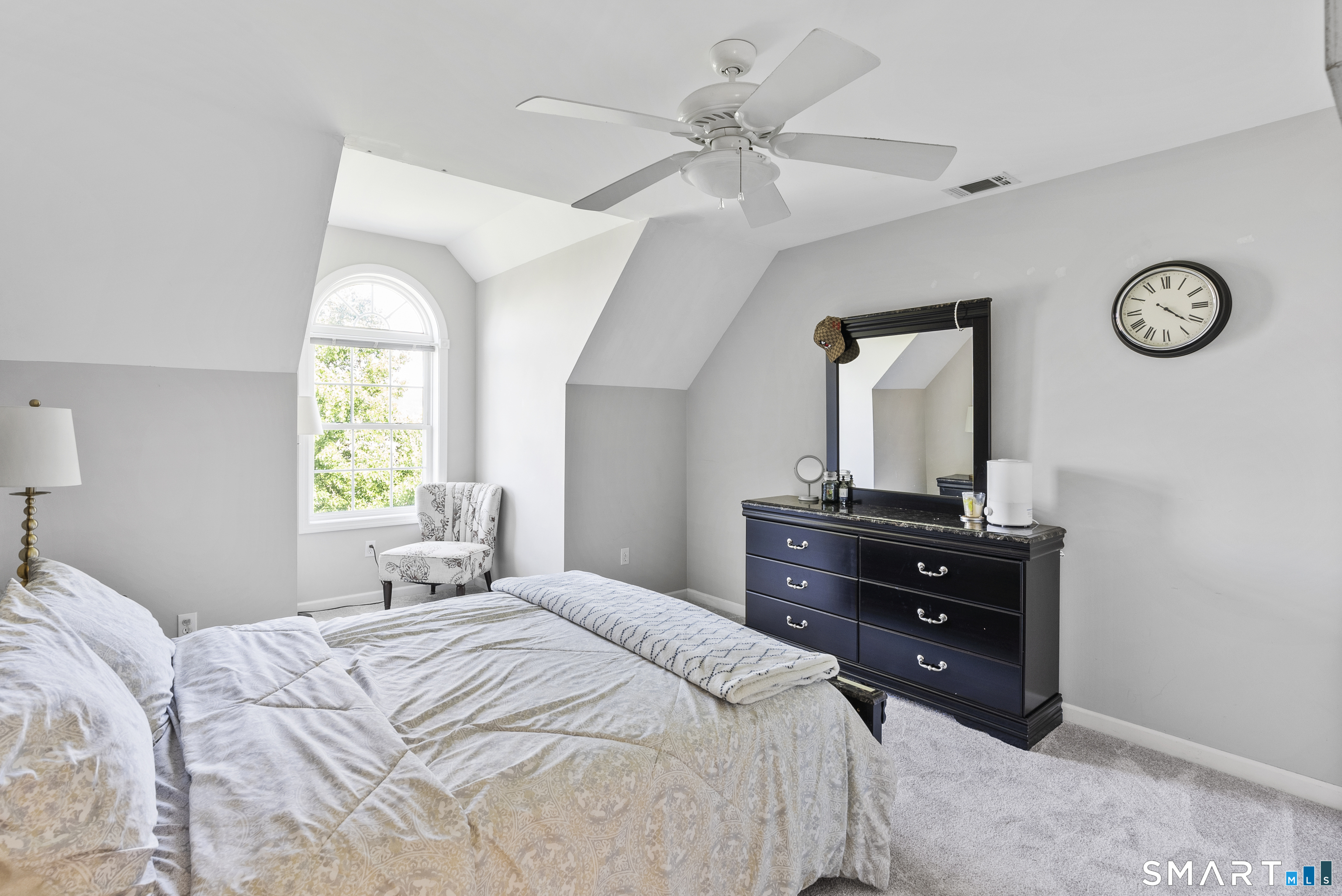 44 Farmstead Lane Suffield, CT 06078 - Photo 19 of 39 a bedroom with a bed and a table with a large mirror