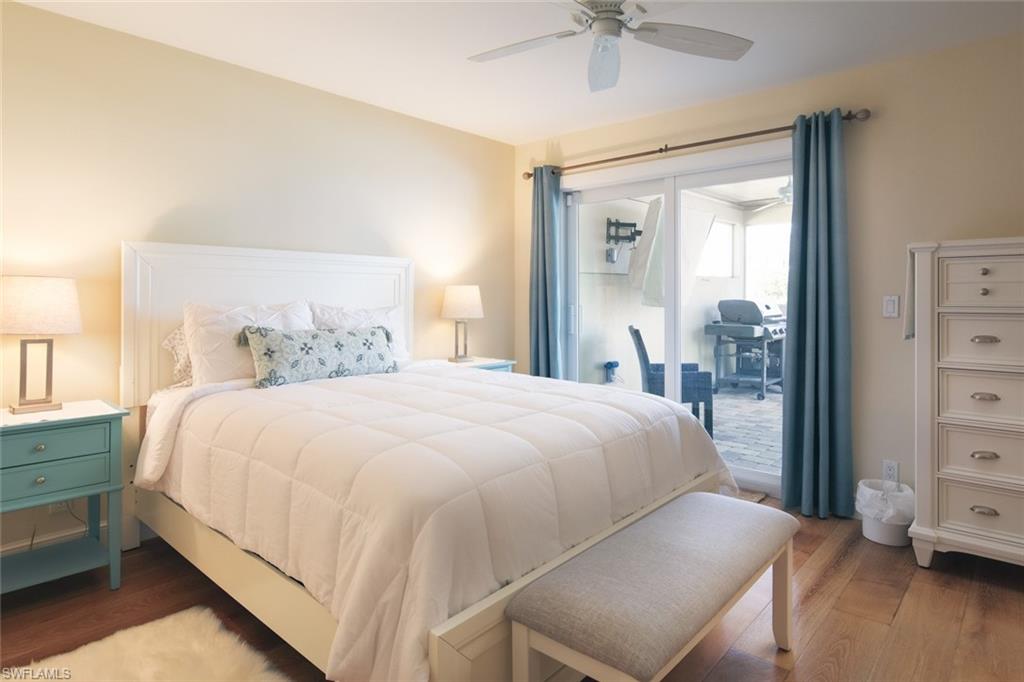 2155 Tarpon Road Naples, FL 34102 - Photo 13 of 27 a bedroom with a bed and a ceiling fan