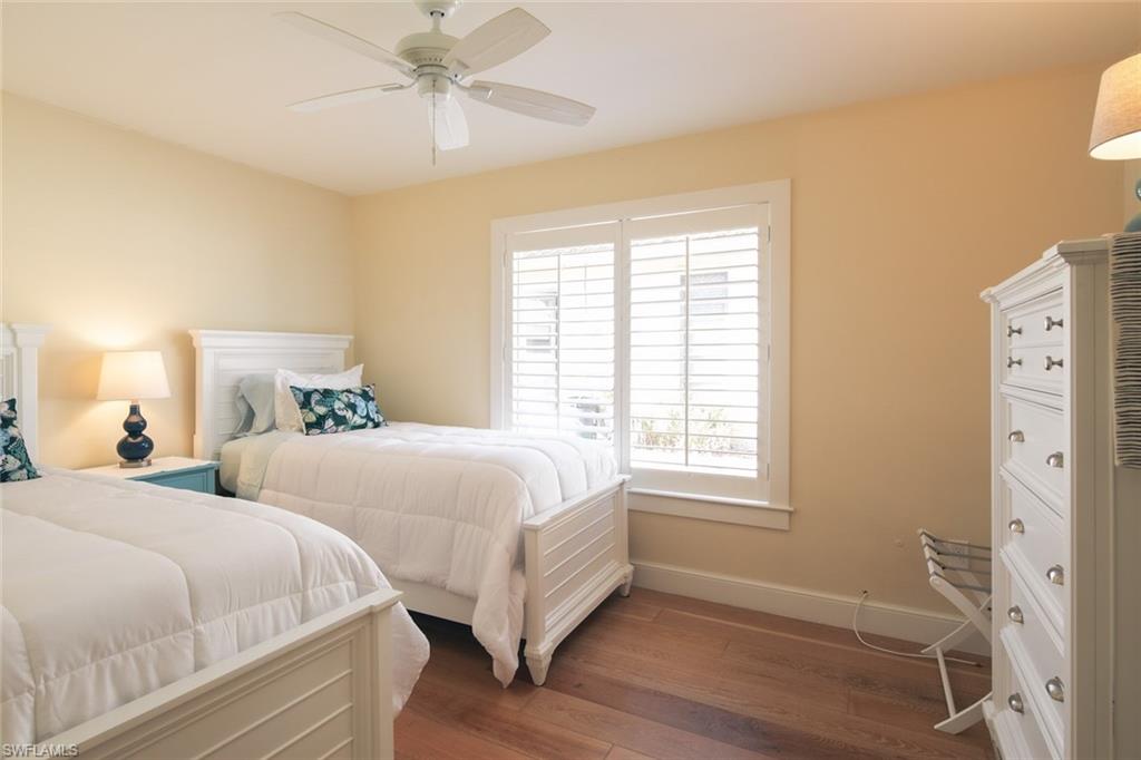 2155 Tarpon Road Naples, FL 34102 - Photo 14 of 27 a bedroom with two beds and a window
