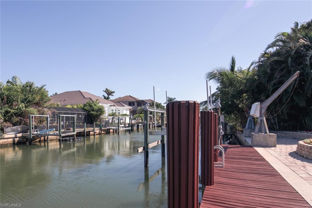 2155 Tarpon Road Naples, FL 34102 - Photo 23 of 27 a view of a house with yard and lake view