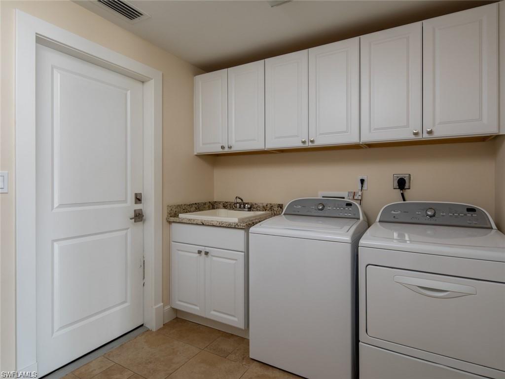 2155 Tarpon Road Naples, FL 34102 - Photo 27 of 27 a utility room with dryer and washer