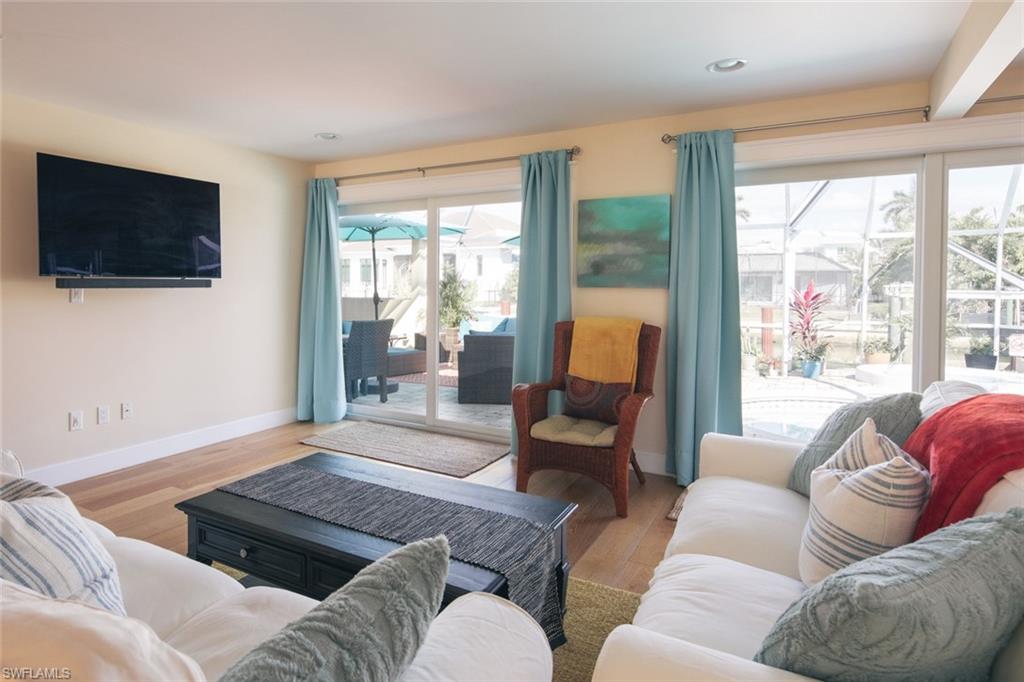 2155 Tarpon Road Naples, FL 34102 - Photo 5 of 27 a living room with furniture and a flat screen tv