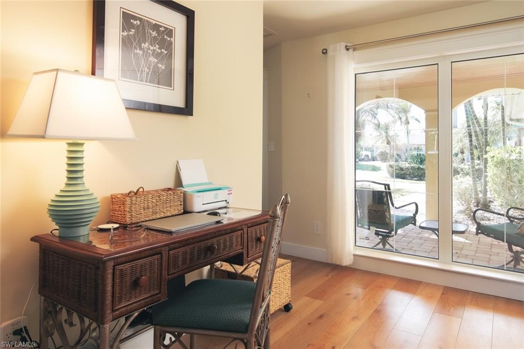 2155 Tarpon Road Naples, FL 34102 - Photo 8 of 27 a view of a workspace with furniture and a window