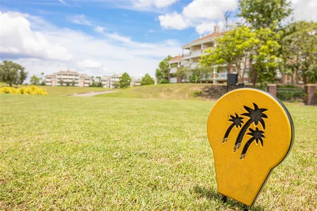 an aerial view of a house with a yard and outdoor seating
