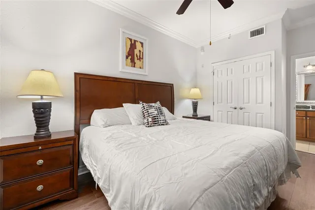 a bedroom with two beds and painting on the wall