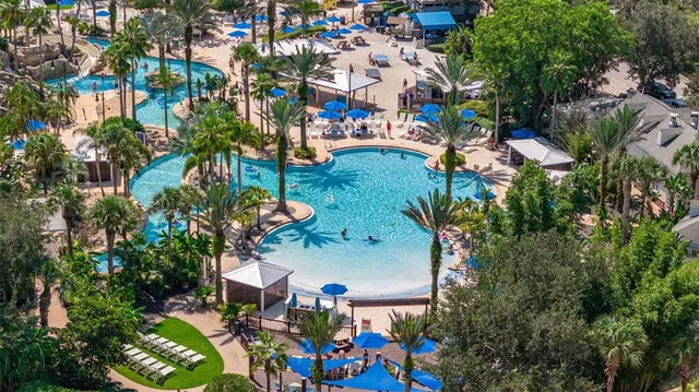 a view of a swimming pool with a lounge chairs