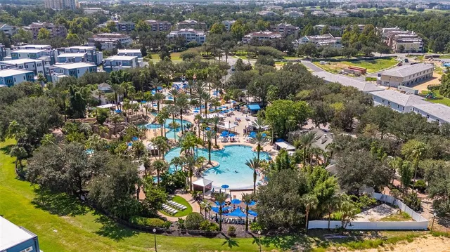 a view of a swimming pool and a yard
