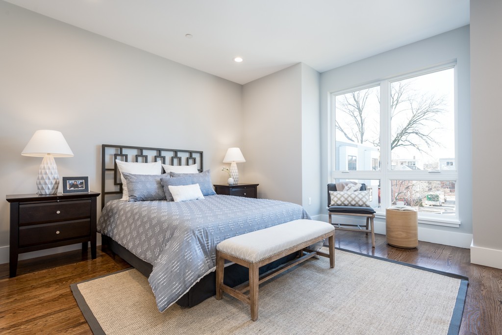 227 Cedar Street, Unit 6 Somerville, MA 02145 - Photo 11 of 25 a bedroom with a bed and wooden floor