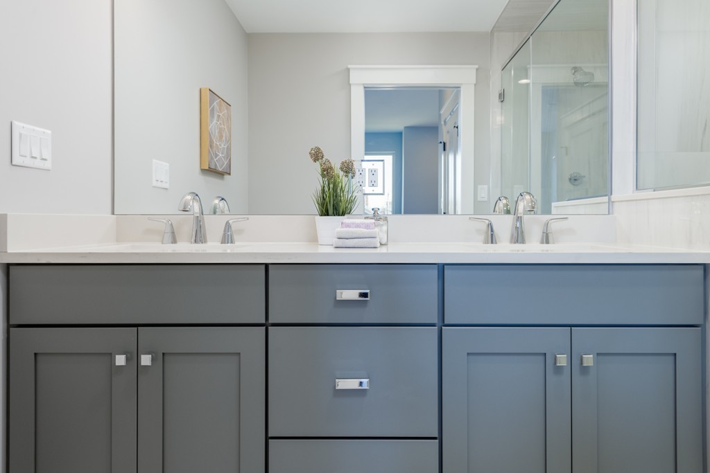 227 Cedar Street, Unit 6 Somerville, MA 02145 - Photo 13 of 25 a bathroom with a double vanity sink and mirror