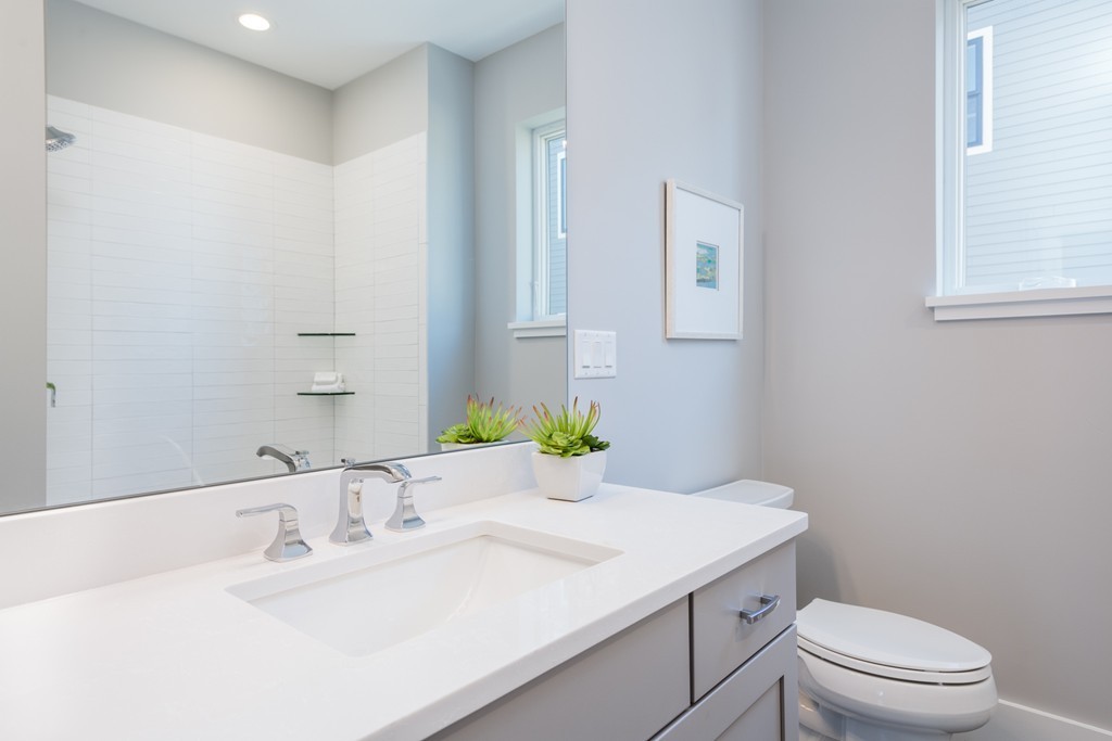 227 Cedar Street, Unit 6 Somerville, MA 02145 - Photo 17 of 25 a bathroom with a sink toilet and a mirror
