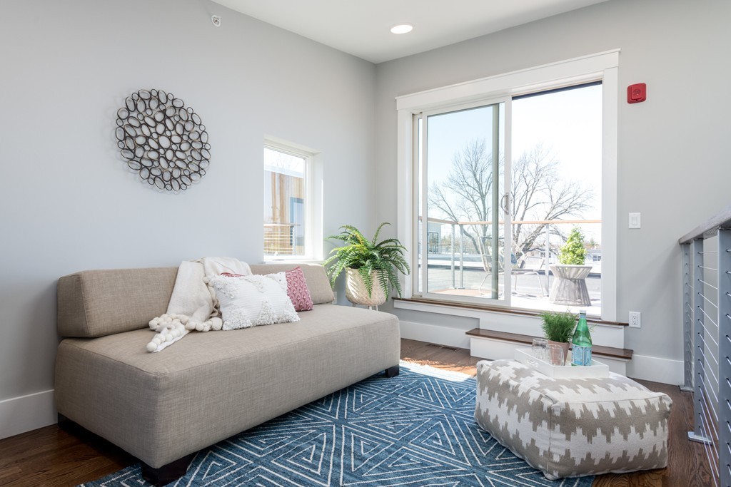 227 Cedar Street, Unit 6 Somerville, MA 02145 - Photo 19 of 25 a living room with furniture and a large window