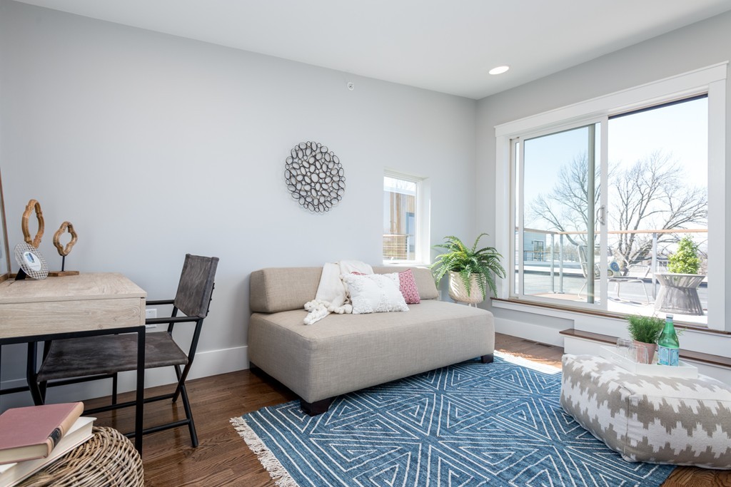 227 Cedar Street, Unit 6 Somerville, MA 02145 - Photo 20 of 25 a living room with furniture and a large window