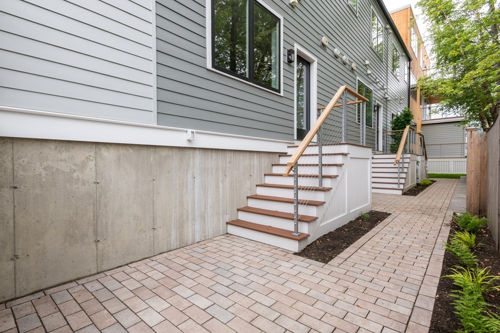 227 Cedar Street, Unit 6 Somerville, MA 02145 - Photo 22 of 25 a view of a patio with table and chairs