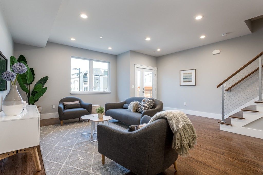 227 Cedar Street, Unit 6 Somerville, MA 02145 - Photo 3 of 25 a living room with furniture a window and a potted plant