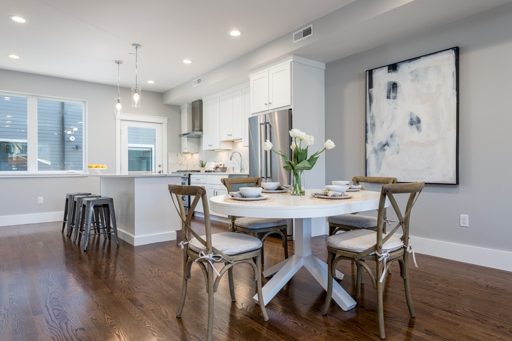227 Cedar Street, Unit 6 Somerville, MA 02145 - Photo 4 of 25 a view of a dining room with furniture and wooden floor