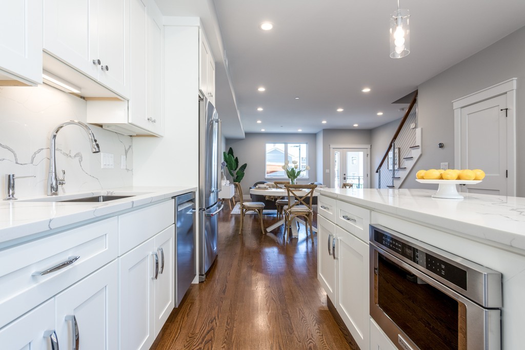 227 Cedar Street, Unit 6 Somerville, MA 02145 - Photo 8 of 25 a kitchen with stainless steel appliances lots of counter top space