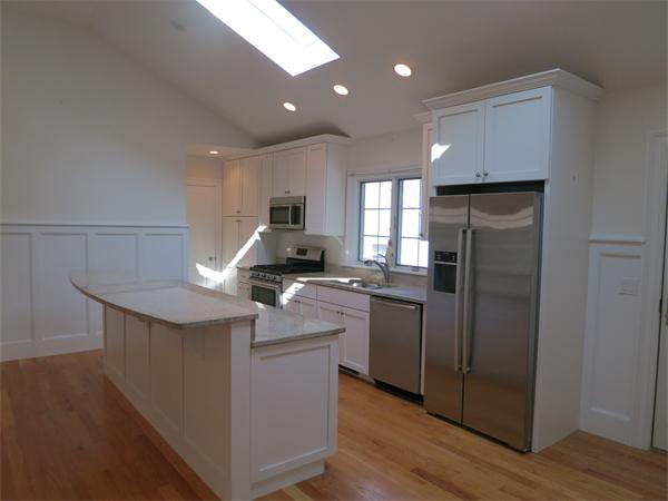 9 Blueberry Road Marblehead, MA 01945 - Photo 4 of 13 a kitchen with kitchen island a sink stove and refrigerator