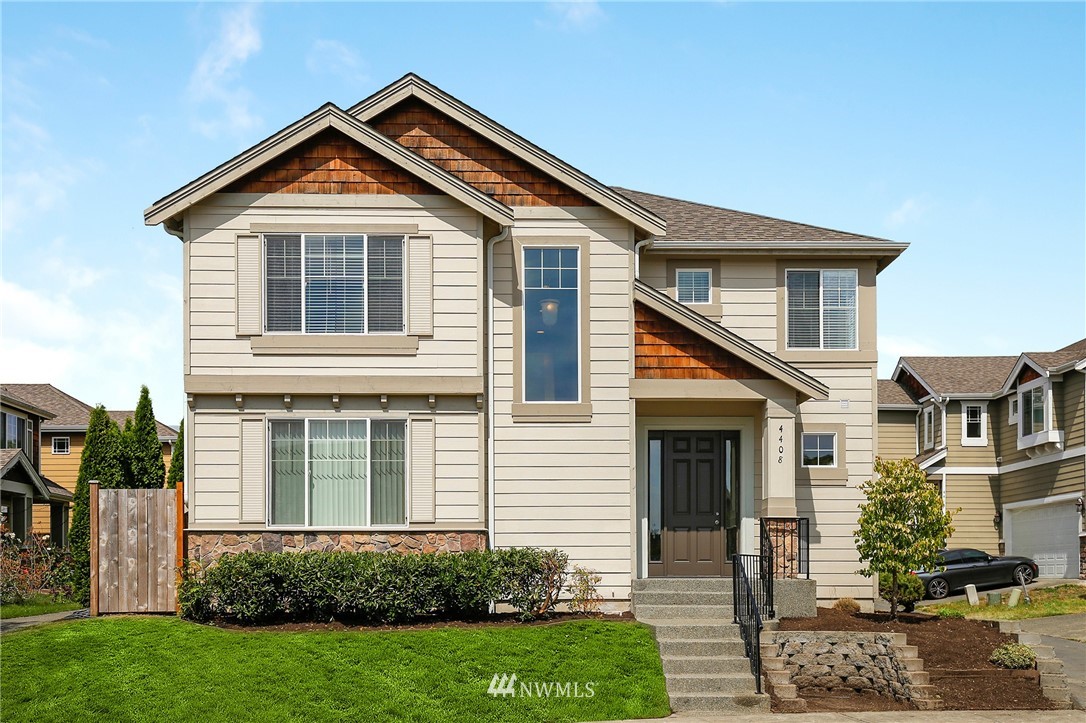 4408 Northeast 3rd Lane Renton, WA 98059 - Photo 1 of 25 a front view of a house with a yard