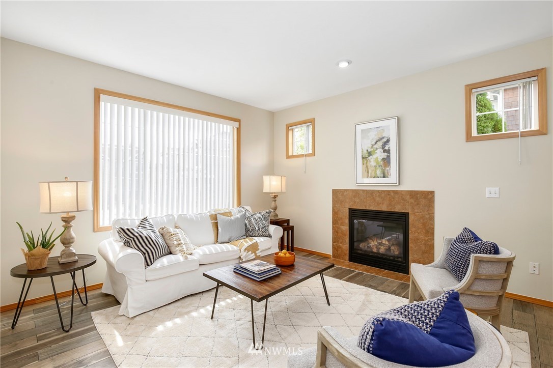 4408 Northeast 3rd Lane Renton, WA 98059 - Photo 2 of 25 a living room with furniture and a fireplace