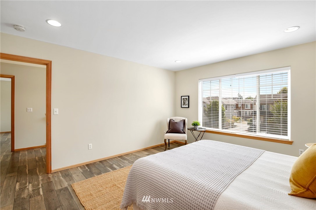 4408 Northeast 3rd Lane Renton, WA 98059 - Photo 13 of 25 a bedroom with a bed and wooden floor