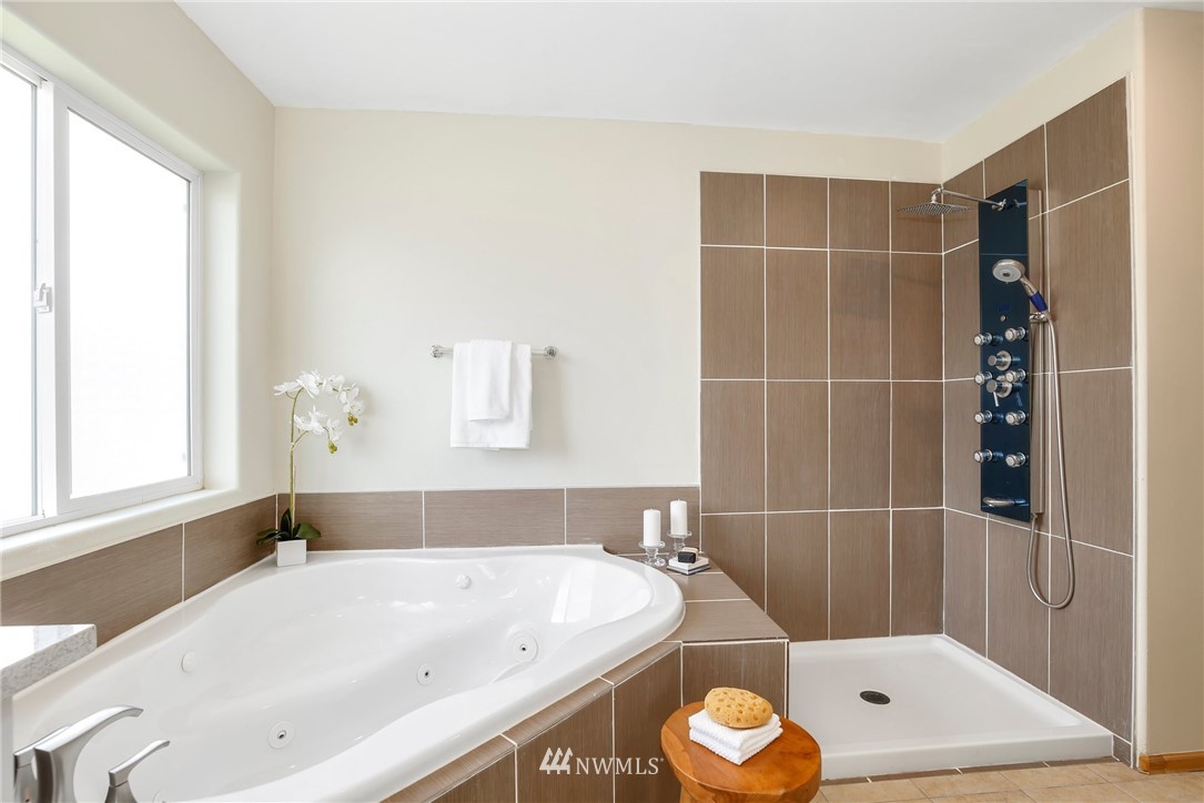 4408 Northeast 3rd Lane Renton, WA 98059 - Photo 15 of 25 a bathroom with a tub and a window