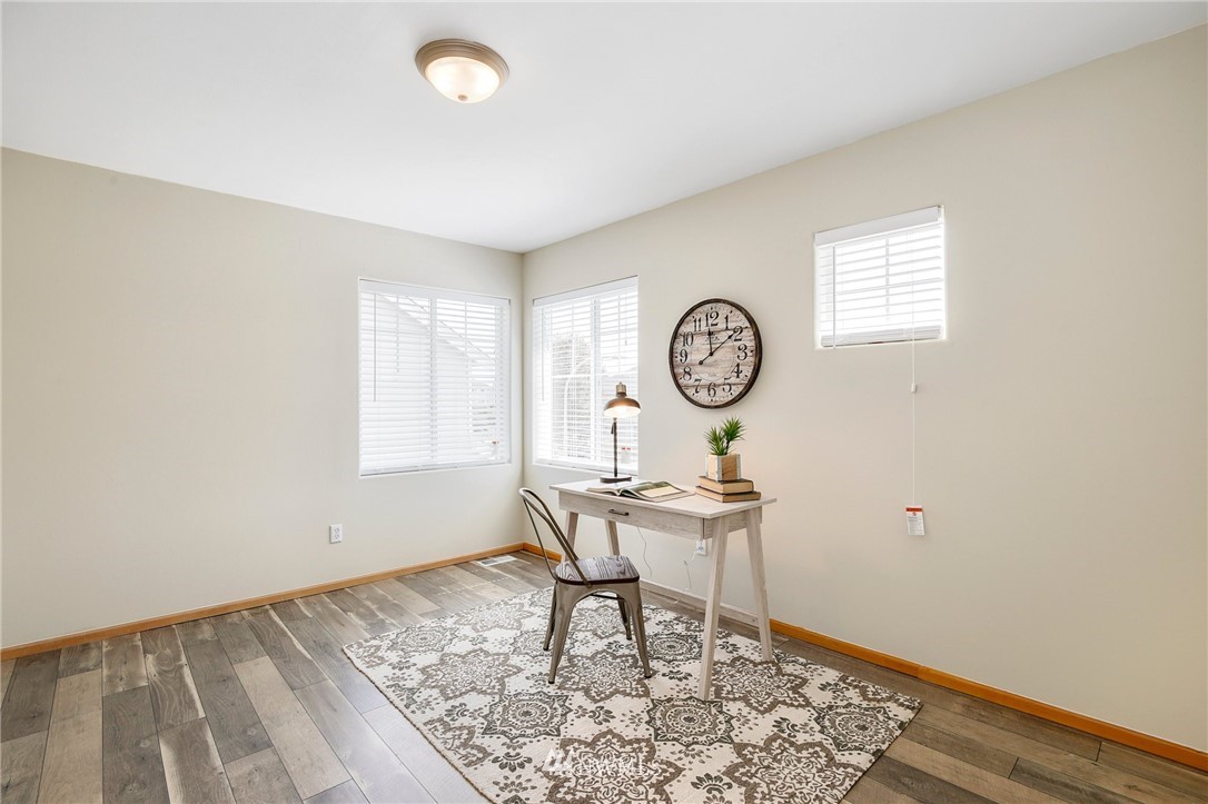4408 Northeast 3rd Lane Renton, WA 98059 - Photo 17 of 25 a view of a room with a wooden floor and a window