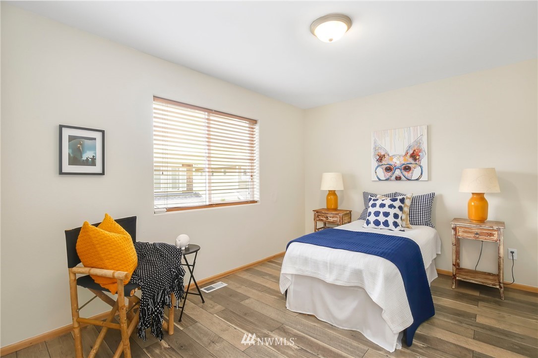 4408 Northeast 3rd Lane Renton, WA 98059 - Photo 18 of 25 a bedroom with a bed and a window