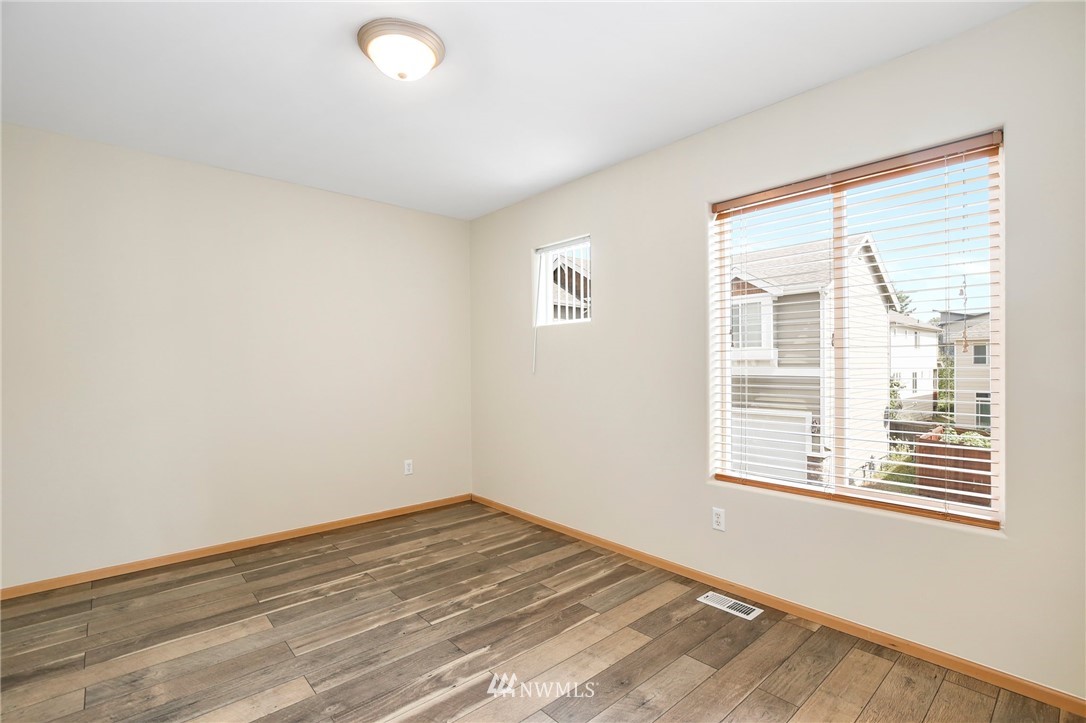 4408 Northeast 3rd Lane Renton, WA 98059 - Photo 21 of 25 a view of empty room with wooden floor and fan