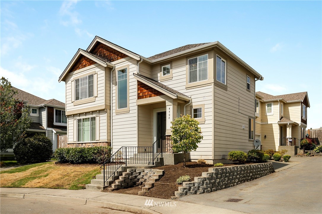 4408 Northeast 3rd Lane Renton, WA 98059 - Photo 25 of 25 a front view of a house with a yard and garage