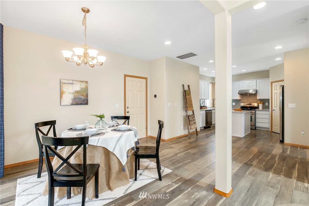 4408 Northeast 3rd Lane Renton, WA 98059 - Photo 5 of 25 a view of a dining room with furniture and wooden floor
