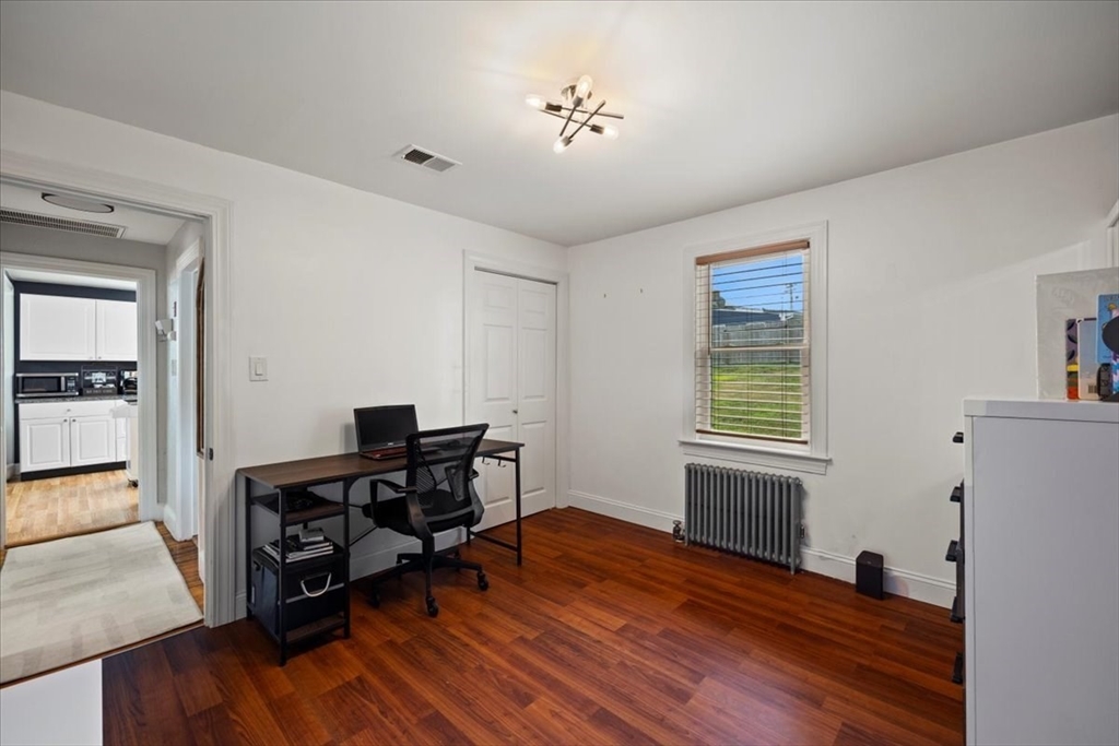 4 Webster Street Randolph, MA 02368 - Photo 13 of 32 a view of a workspace with furniture and a window