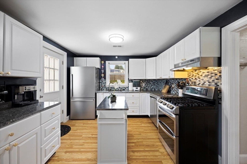 4 Webster Street Randolph, MA 02368 - Photo 16 of 32 a kitchen with granite countertop a refrigerator stove top oven and sink