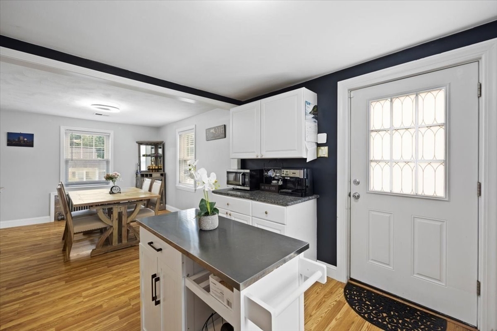 4 Webster Street Randolph, MA 02368 - Photo 19 of 32 a kitchen with a stove a sink and cabinets