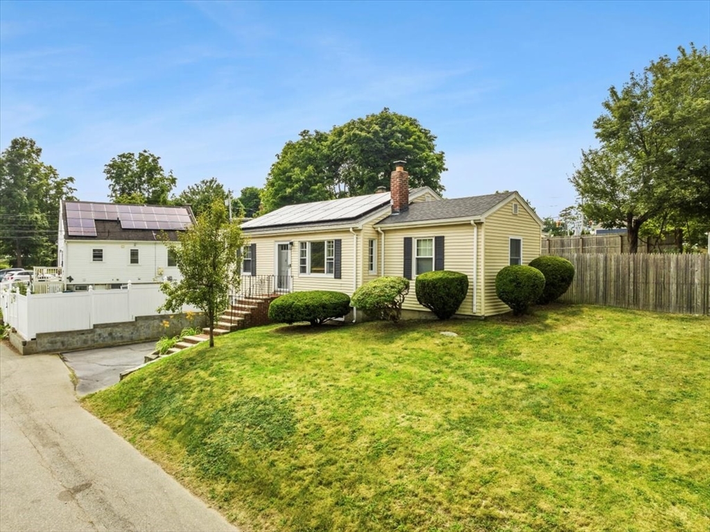 4 Webster Street Randolph, MA 02368 - Photo 2 of 32 a front view of a house with garden