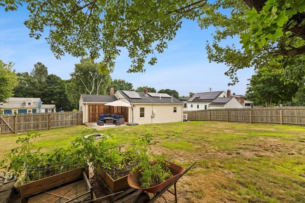 4 Webster Street Randolph, MA 02368 - Photo 28 of 32 a view of a house with pool and chairs