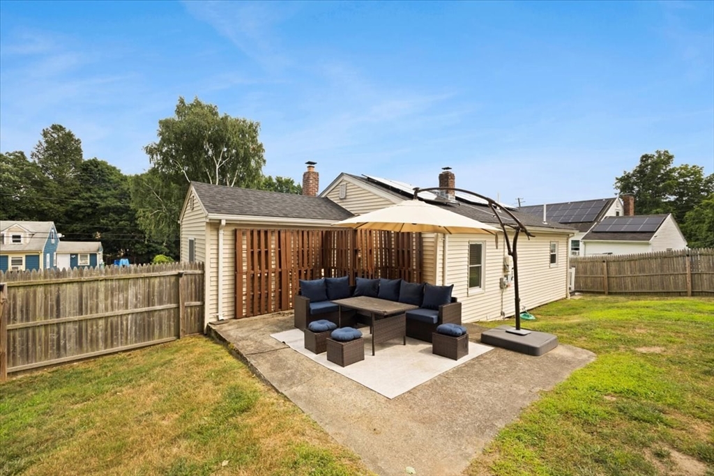 4 Webster Street Randolph, MA 02368 - Photo 30 of 32 a front view of house with yard outdoor seating and barbeque in the background
