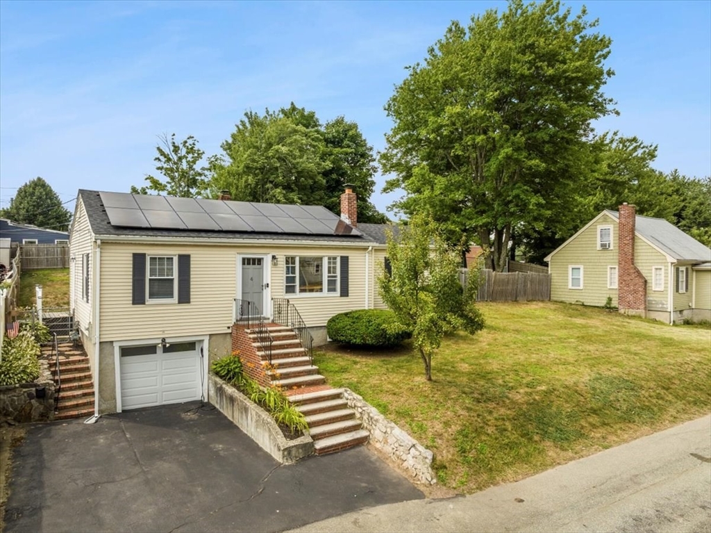 4 Webster Street Randolph, MA 02368 - Photo 3 of 32 a front view of a house with garden