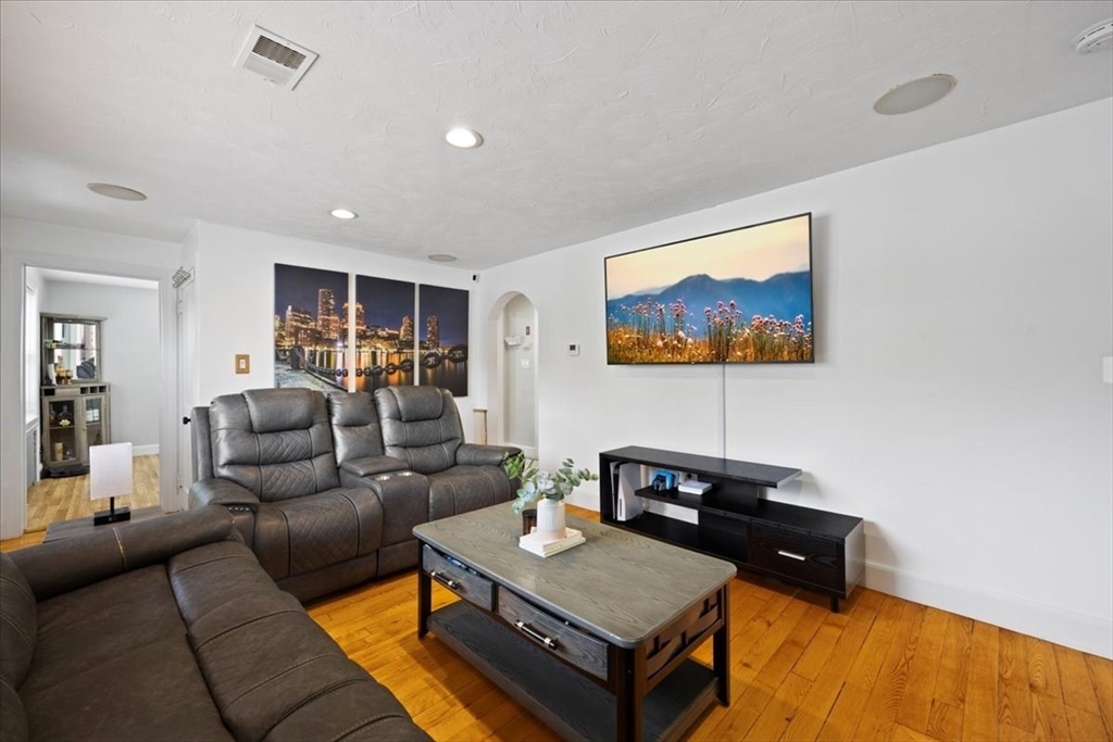 4 Webster Street Randolph, MA 02368 - Photo 6 of 32 a living room with furniture and a flat screen tv