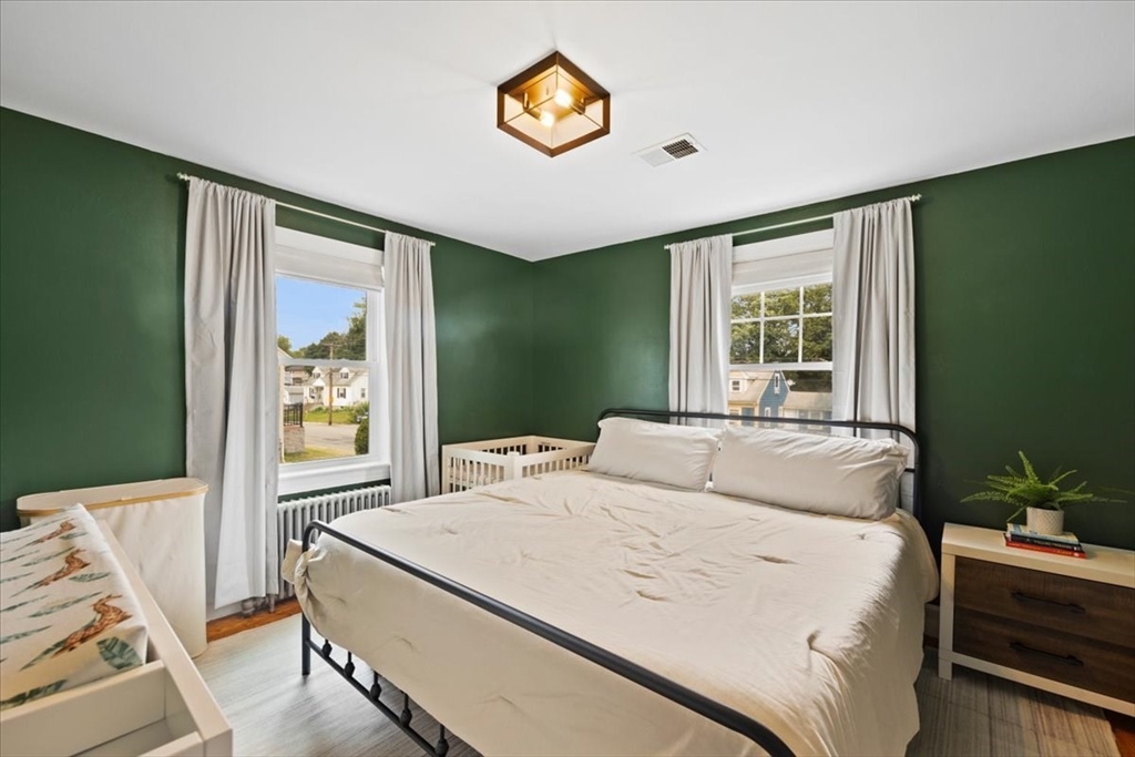 4 Webster Street Randolph, MA 02368 - Photo 8 of 32 a bedroom with a bed and a window