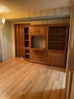 a view of closet area with empty racks