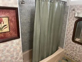 a bathroom with a sink a mirror and vanity