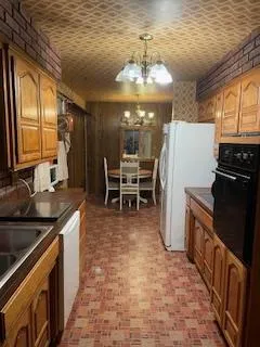 a view of living room with furniture and a fireplace