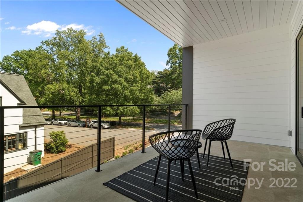 616 Queens Road Charlotte, NC 28204 - Photo 15 of 38 a view of a chairs and table on the balcony